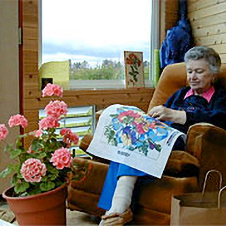 Woman doing needlepoint